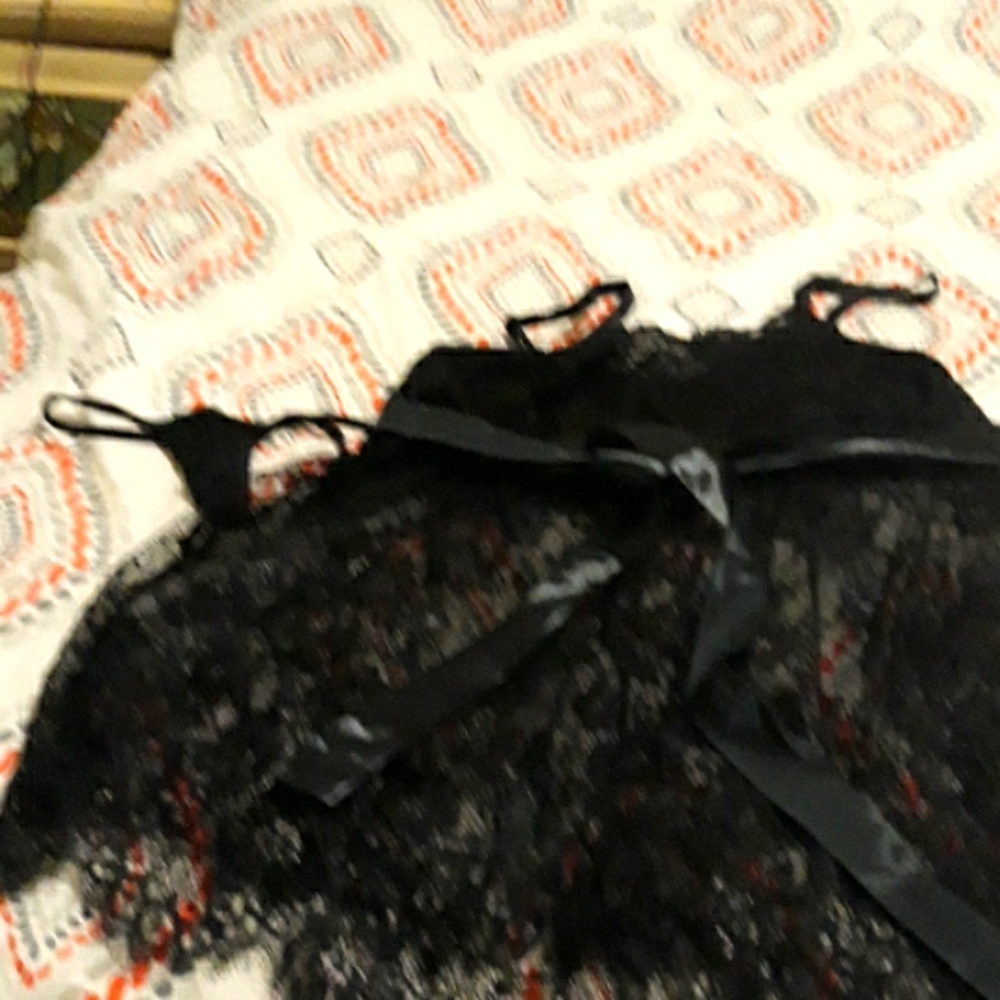 Dark Rose For Him Black lace lingerie with g-string panties and a black ribbon.